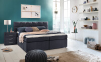 Boxspringbett Bea in blau midnightblue mit quadratischer Steppung und Visco Topper im Schlafzimmer